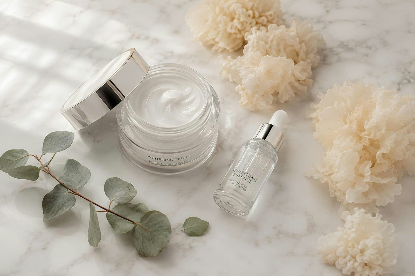Skincare cream and serum on marble
