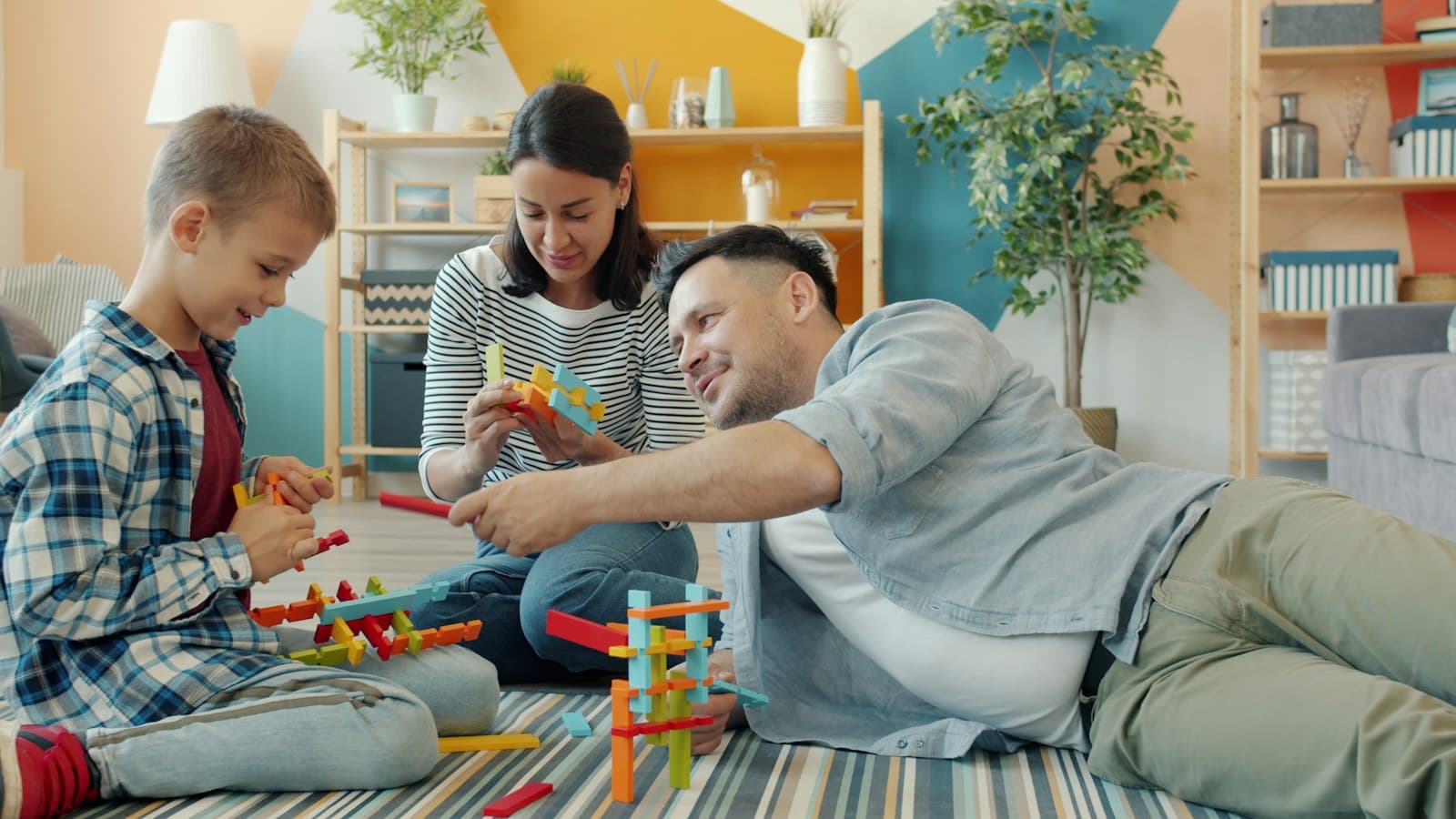 A family building with toy blocks