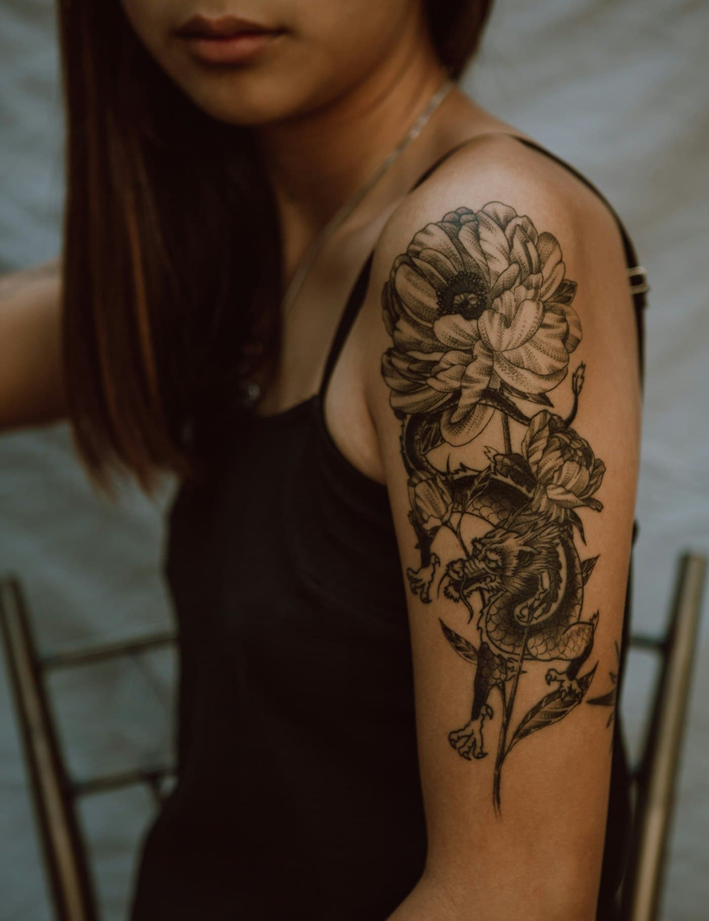 A floral tattoo on an upper arm
